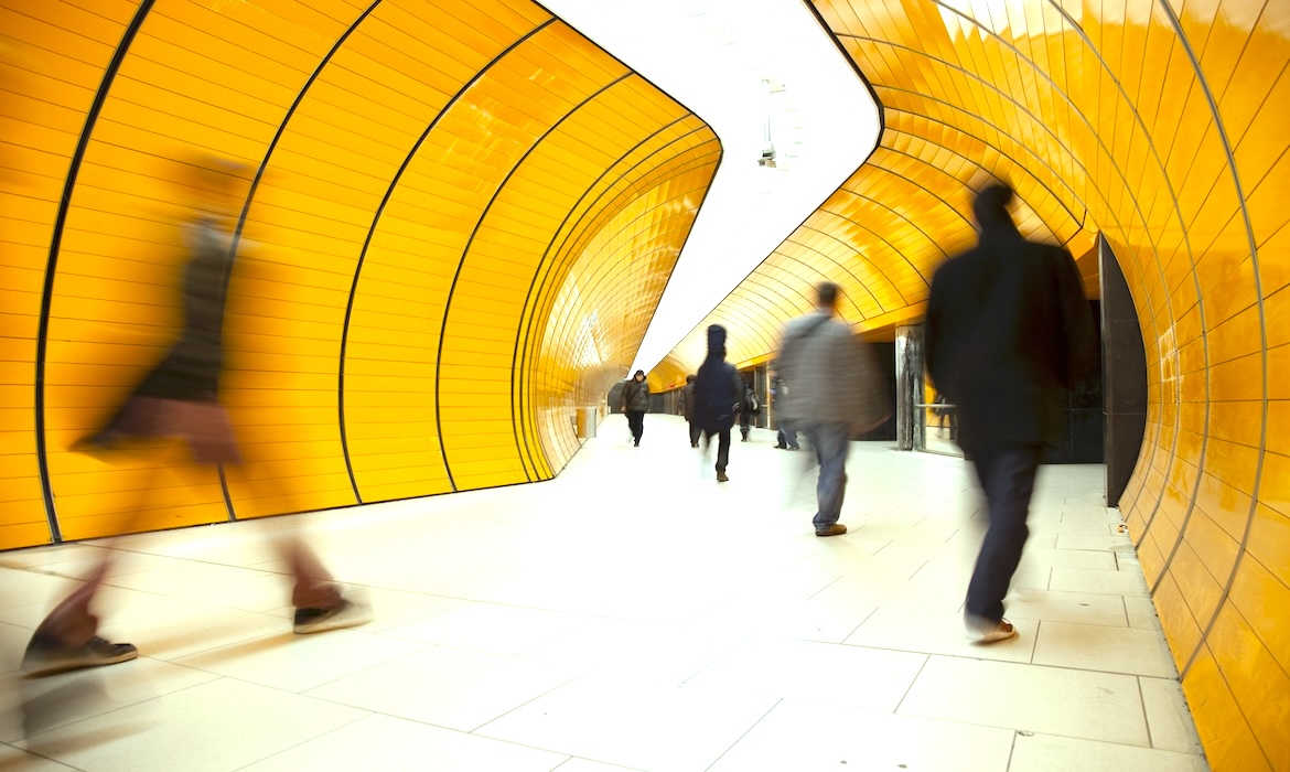 Image of people walking in a tunnel demonstrating speed and scale